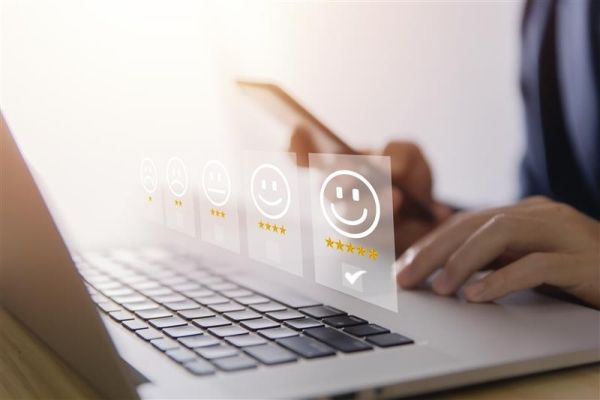 customer's hands filling out digital online review or survey