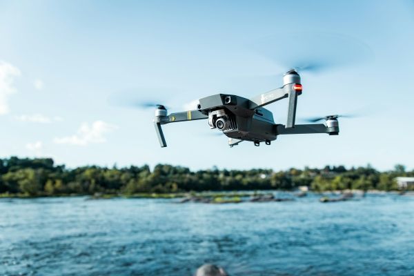 Drone flying over water