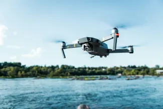 Drone flying over water